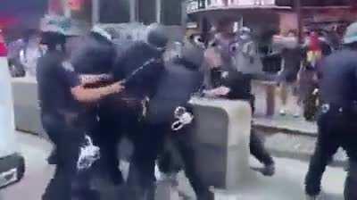 Protester Standing On Car Swarmed By A Sea Of Police