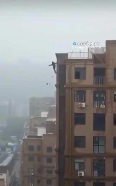 man falls off roof when trying to create a tiktok video