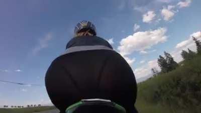 Long dildo on a bike