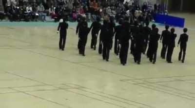 Japanese high school students demonstrating precision walking