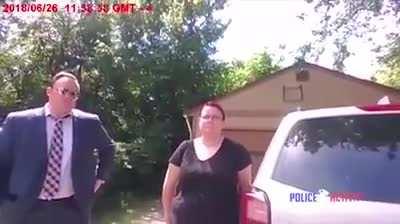 Police confronts reporters seeking an interview with a rape victim