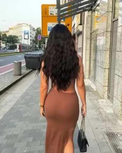 Beauty in a tight brown dress