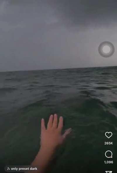 Out in the open sea while it’s raining.