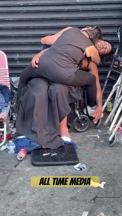 Flies cover the crotch of passed out junkie