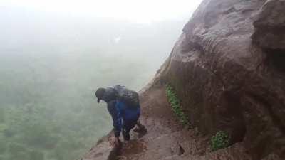 Kalavantin durg trek with wet steep rock cut stairs in sandals
