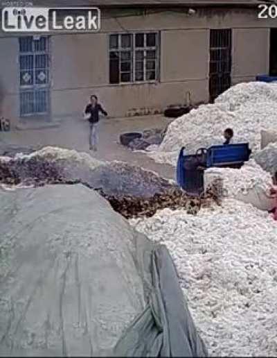 WCGW using a lighter to open bags at a cotton warehouse