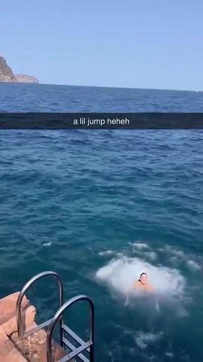 Olivia jumping in the sea