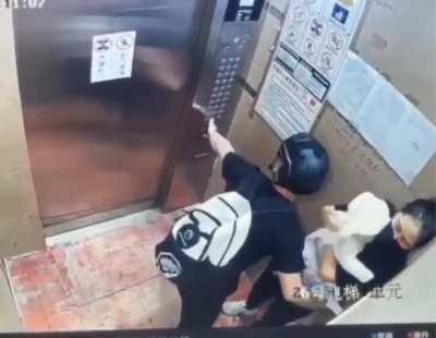 Courier protects mom and baby as an elevator malfunctions 