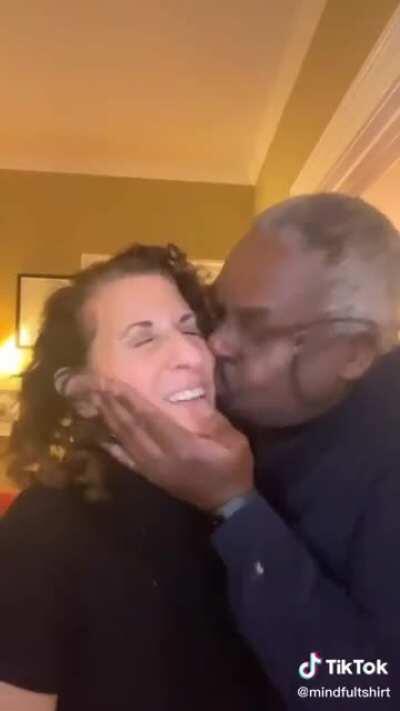 Man brutally assualts woman............with kisses