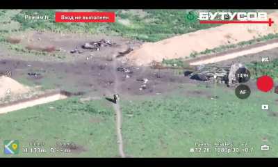 Ukrainian drone footage showing Russian infantry soldiers on a motorcycle trying to advance through a minefield.