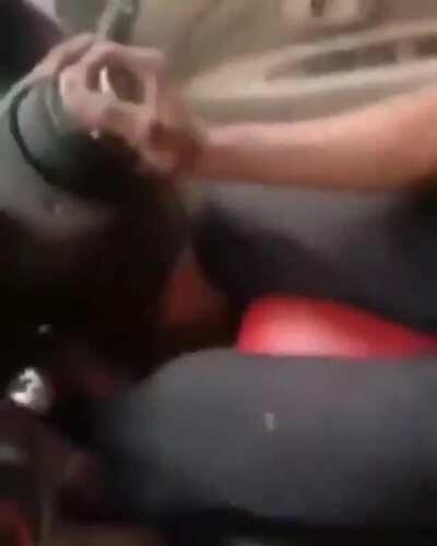 This guy is driving a car without a steering wheel