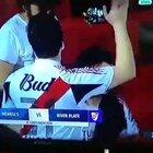 Just a soccer fan sniffing some substance.