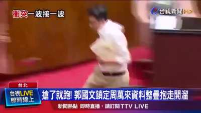 A member of Taiwan's parliament stole a bill and ran off with it to prevent it from being passed.