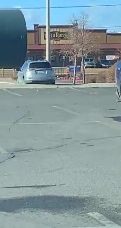 Cylinder rolls perfectly between two cars in a parking lot (Source: skrattch on TikTok)