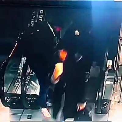 Dude losing his shoes in an escalator