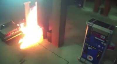 Guy try’s to light a spider on fire at gas station