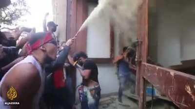 Protesters in Mexico set fire to police after they beat a man in custody to death