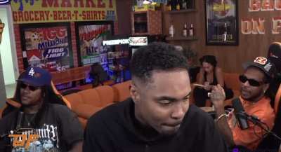 Heather takes down Smac sign off the wall