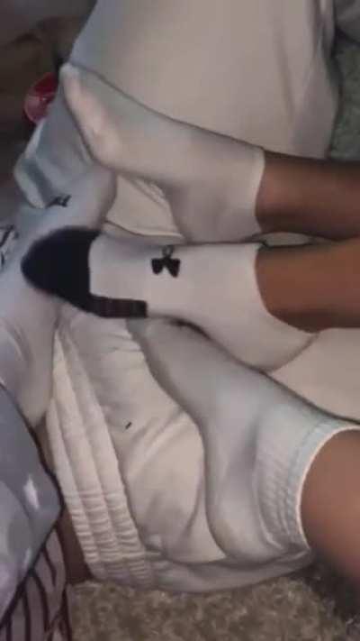 4 girls rub feet on crotch