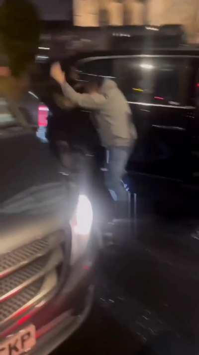 A Deliveroo delivery person got into a fight with a taxi driver in London last night.