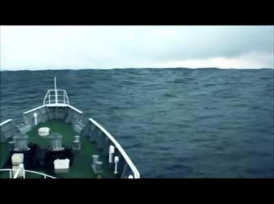 Japanese coast guard boat rides over the tsunami that would hit japan on the 11th of march 2009