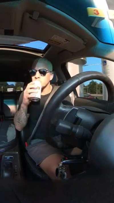 Guy Reviews Alcoholic Beverage While Driving