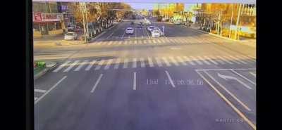 Semi in China literally pancakes a car and plows through two others.