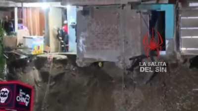 A police officer was saved from dying Tuesday night after a freezer fell on her while carrying out rescue work