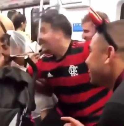 A group of human bros singing Baby Shark to cheer up a little girl on the subway.
