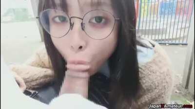 Amateur Japanese Girl With Glasses Deepthroating A Cock In A Park