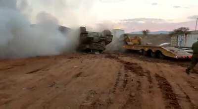 IDF Merkava mk3 flips while being loaded on a transporter