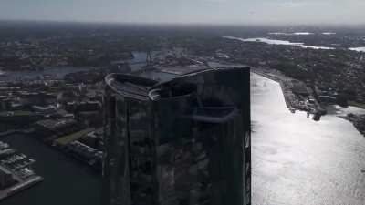 Drake attempts to take down a drone flying outside his penthouse in Australia