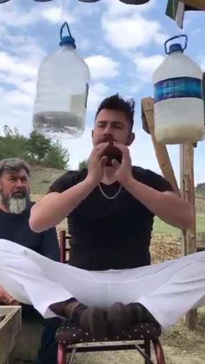 Bringing the balance of meditation with gallons of water... This man is a winner...