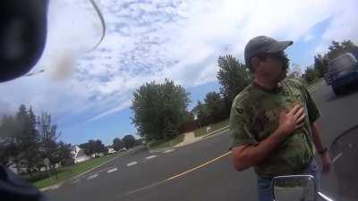 Biker And Motorist Share A Moment After Near T-Bone Collision