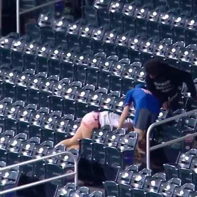 [Highlight] A couple of fans lollygag while another one goes home with the souvenir.