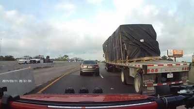 Trucker negotiates a curve with heavy load