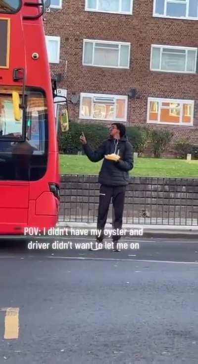There's this dude blocking the bus and refusing to move, so the bus can't even go. And to top it off, he's just chowing down, causing the bus to be late.