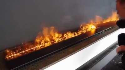 These flames are touchable. They are not even flames, actually as they are made by water vapor lit by LED lights