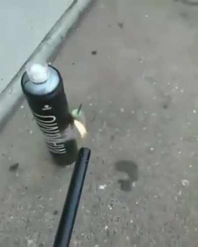 Taping a cracker to an aerosol can
