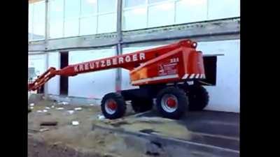WCGW riding an aerial platform from a raised floor