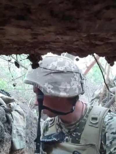 Ukrainian soldier records himself in a trench almost being hit by a mortar in the Donbass region. Date unknown.