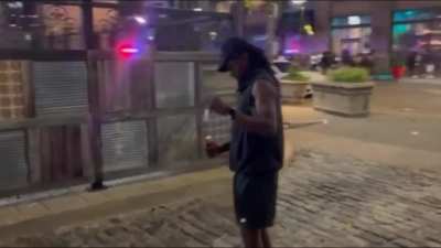 Man films himself laughing and lighting a firework before throwing it into a bar in St. Louis, Missouri.