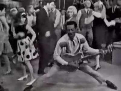 Chuck Berry in the 60s. What I love even more is the crowd behind him. Especially the chick in polka dot skirt.