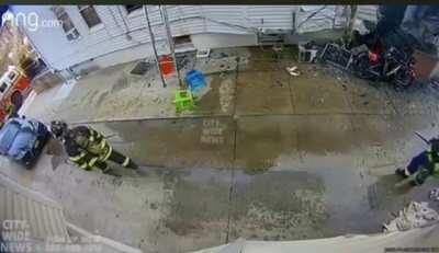 An AC hits a firefighter, on the head.