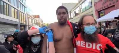 This hero stopped a right wing terrorist trying to shoot peaceful protesters with a gun last night in downtown Seattle. He is the face you should see.