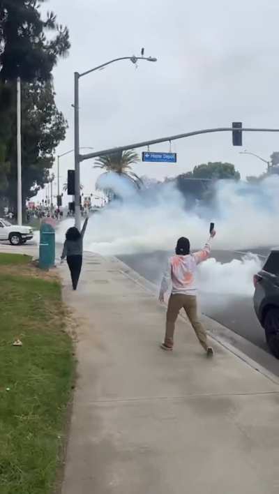 Massive barrage of tear gas deployed to cover ICE agent's exit from raid