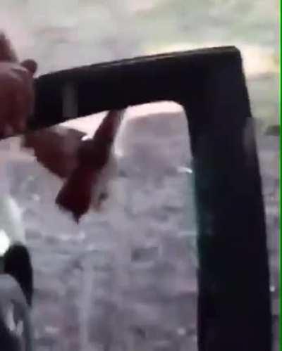 Using your car window to open a bottle