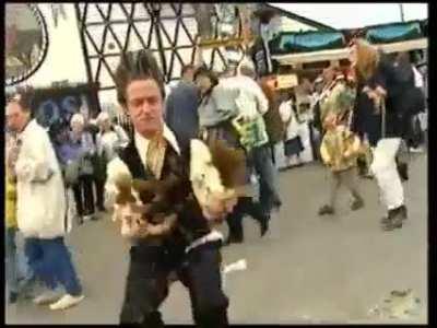 German TV Moderator playing with horse apples