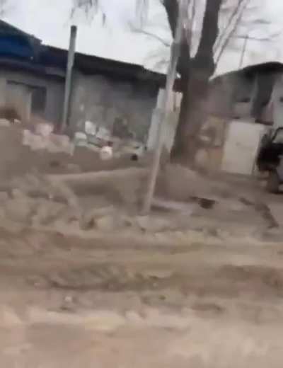 A Russian soldier films the moment a Ukrainian FPV quad hits a Ural truck while his comrades try to shoot down the UAV.