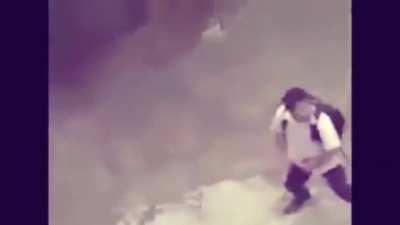 The Boys dancing around a bluetooth speaker